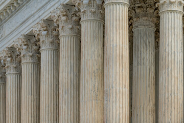 Fototapeta premium Columns marble Tall vertical repetition. Columns architectural symmetry pattern. Columns decorative capitals ornament elements. Columns neoclassical classical design.