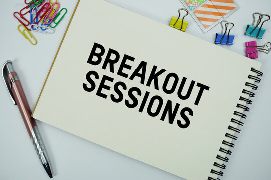 Breakout Sessions text message written on notepad with stationery flat lay on white background