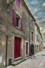 Fototapeta premium Uzes in France, old facades in the historic center, typical street 