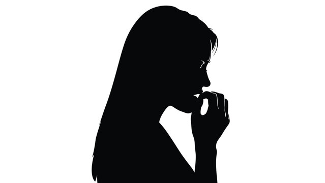 Silhouette portrait of a nervous woman biting her fingernails while dealing with significant worry or anxiety in isolation