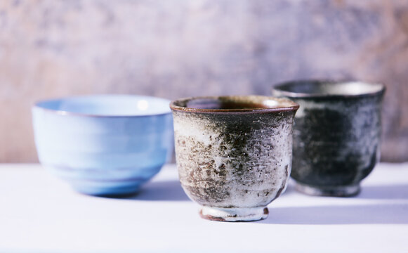 Traditional japanese ceramic on rustic wooden background. Soft focus. Copy space.