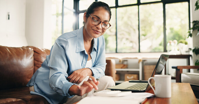 Woman, finance or calculator with laptop in home for budget planning, bills or expenses. Female person, accounting or checklist with documents on sofa for financial audit or asset management in house