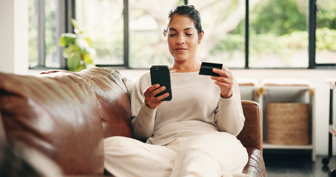 Happy woman, phone or relax with credit card on sofa for online shopping, banking or payment in home. Mature person, shopper or user with debit or mobile smartphone for ecommerce, order or purchase