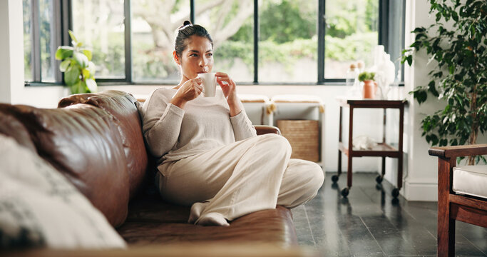 Calm, woman and thinking with coffee, lounge and planning for decision with caffeine and thoughtful. Morning, reflection and person with hot beverage on couch, remember and wonder with tea in home