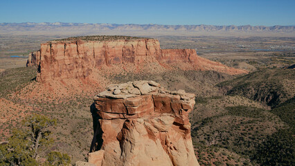 Red Rock Buttes and Sandstone Canyons Under Clear Blue Sky