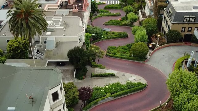 Iconic winding Lombard Street in San Francisco with lush greenery and brick pavement