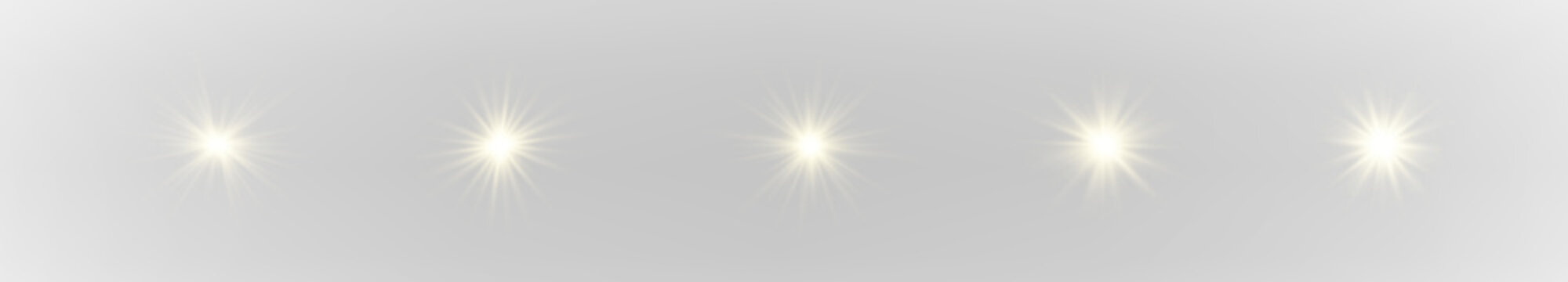 Set of sparkling golden stars with radiant glow, soft highlights, and layered vector design. 
