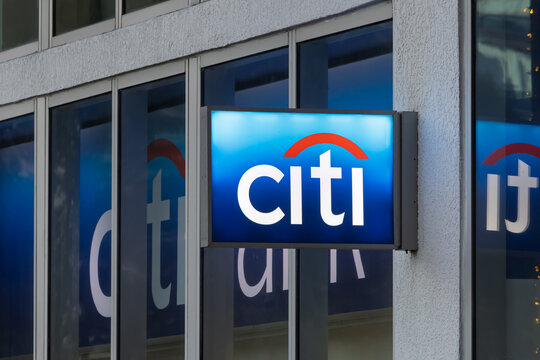 Citi bank sign on building facade reflecting sky at downtown Miami, Florida.