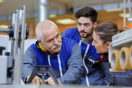 young woman and man working at teacher