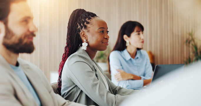 Audience, listening and meeting with business woman in boardroom for development or education. Attention, happy and workshop with corporate employee at table in office for seminar or upskill training