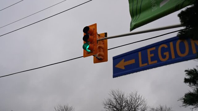 Orange Traffic Light Illuminates Green Light Over an Intersection in Whitby, Ontario, Canada.