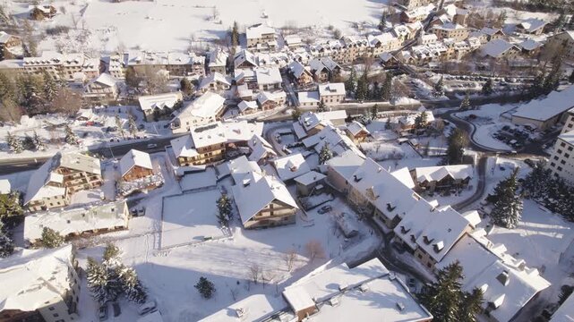 Snow-Covered Alpine Village And Resort Infrastructure In Serre Chevalier, French Alps, Winter Tourism- Aerial Drone View