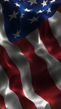 Vertical 9 16 orientation of the United States flag waving in the wind. High quality seamless loop animation optimized for mobile screens and patriotic social media holiday backgrounds.