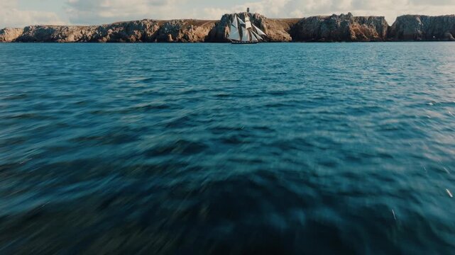 Reveal shot of sailing ship near Pointe de Pen Hir cliffs, Brittany, France