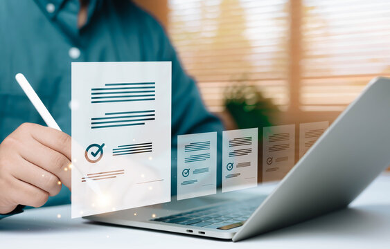 Online document approval and digital checklist concept with virtual forms and check marks on laptop screen. Business compliance, e signature, quality control, audit process, and workflow management.