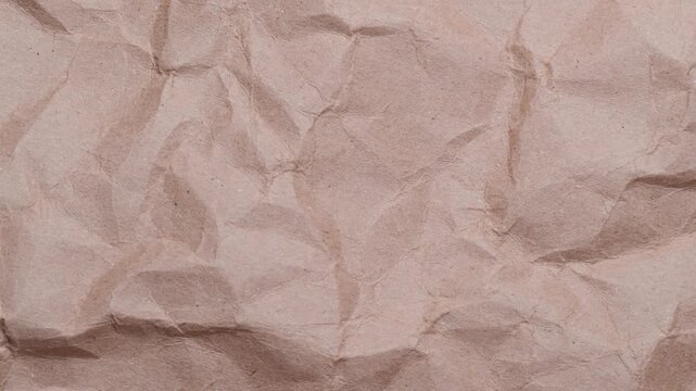 Stop motion of crumpled craft brown paper texture, abstract loop background