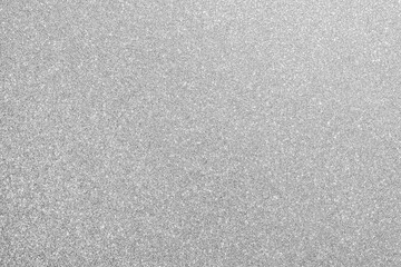 Fototapeta premium Shimmering silver glitter texture background, sparkling surface for festive, holiday and luxury designs. Ideal for cards, packaging, websites, banners and creative craft projects needing sparkle.
