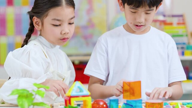 Children Collaborating With Colorful Blocks in Classroom STEM Activity