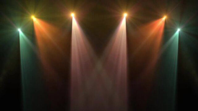 Colorful stage lighting and beams in a dark concert hall for live show music performance