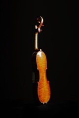 Leandro Biaggi master violin on dark background, luxury classical string instrument close-up, Italian craftsmanship concept