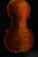 Leandro Biaggi master violin on dark background, luxury classical string instrument close-up, Italian craftsmanship concept