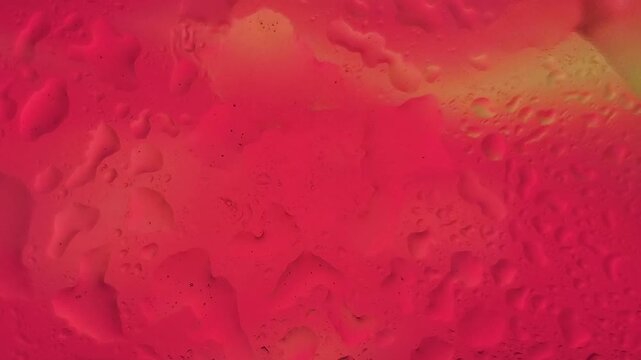 Abstract close-up of textured red and yellow surface with embossed pattern.