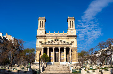 Scenic sunny view of the symmetrical neoclassical architecture, twin towers, and wide stone stairs...