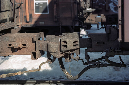 Train couplers hooked together in snow