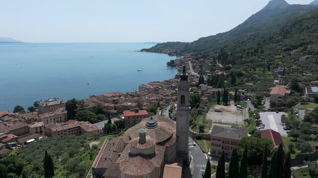 Europe Italy Lake Garda Gargnano fly by a famous Church aerial drone view in 4K 60fps