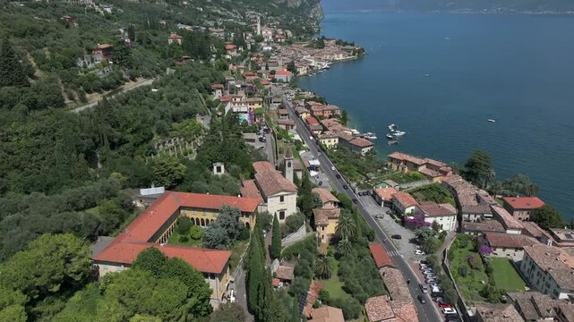 Europe Italy Lake Garda little village called Gargnano near lake with beautiful streets 4K 60fps Aerial Drone View