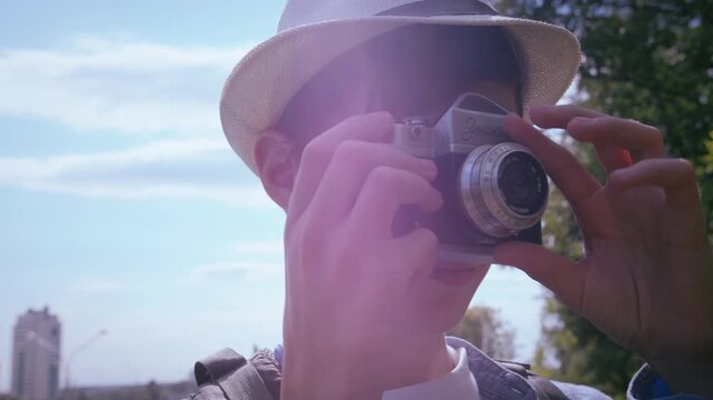 Urban Safari: Young Boy Using a Camera to Document His City Exploration Journey