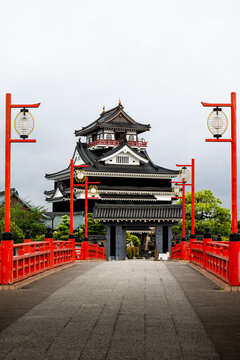 Traditional Japanese castle in rain with cinematic dark clouds in Japan