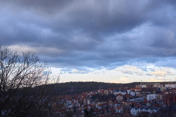 Evening Panoramic View of a City with Dramatic Cloudy Sky
