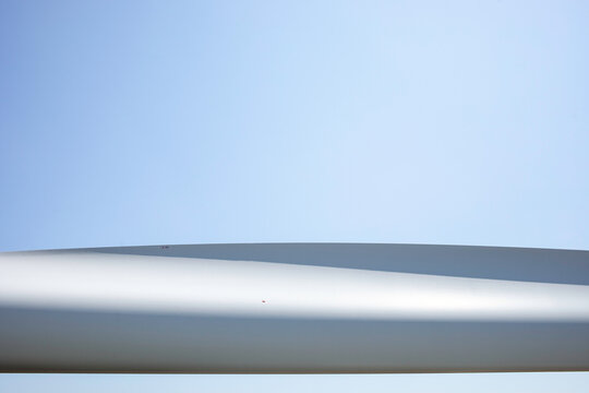 Abstract of wind turbine blade against plain sky
