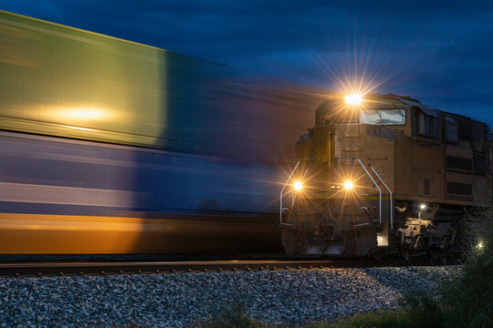 Trains passing in the night motion blur