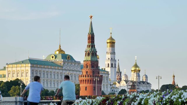 Tourists enjoying city life close to the iconic Moscow Kremlin in Russia