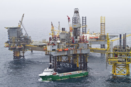 Esbjerg, Denmark - 13 February 2026: Aerial view of the imposing oil rig platform standing firm amidst the vast expanse of the North Sea, a testament to engineering prowess.