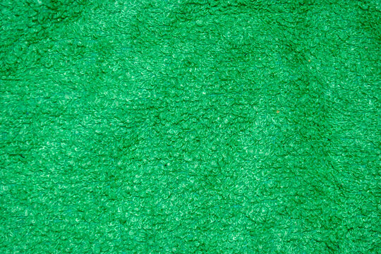Textura de primer plano de una toalla de algod&oacute;n color verde brillante