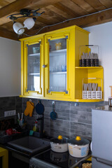 A kitchen with a bland of modern and rustic elements under a natural light.