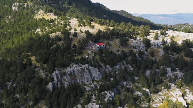 Slow panoramic drone shot showcasing Spilios Agapitos refuge, Zolotas refuge, in Mount Olympus, Greece