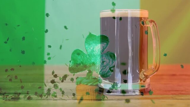 With tricolor overlay rising, shamrock confetti drifting near mug and cupcake, evoking Irish theme