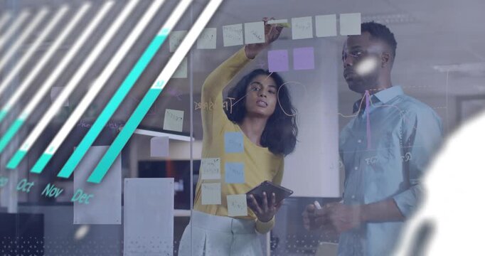 Business team placing sticky notes tapping tablet causing animated charts finalizing timeline