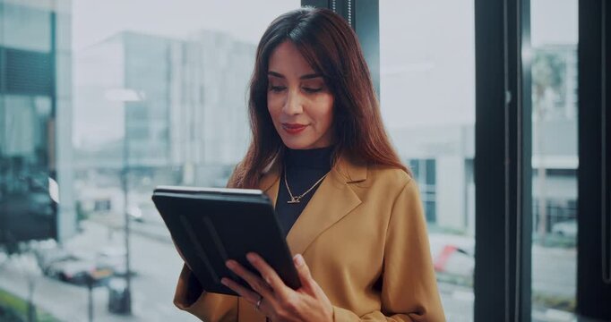Woman, tablet and smile with typing at office with report, notes or checklist at media company. Mature person, journalist and tech with app, scroll and notification for feedback at creative agency