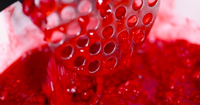 juicy red grated strawberries in a bowl, making a sweet, delicious and juicy dessert from natural berries, a large bowl with grated ripe strawberries while making jam or desserts