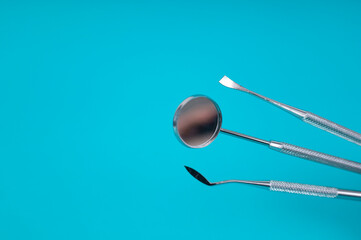 Dental Tools on Blue Background for Modern Dentistry Practices