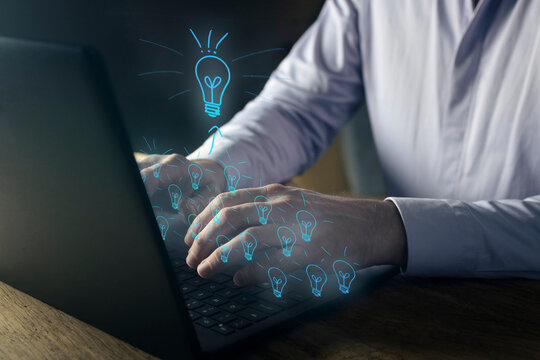 Closeup of businessman hands typing on a computer notebook. Digital content creation. Brainstorming ideas and business success