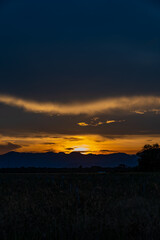 Senset moment view behind the mountain in the golden light from the sun.