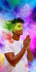 Fototapeta premium Young man praying with colorful powder explosion background. Concept of Holi spiritual tradition, mindful celebration moment, cultural heritage symbolism and vibrant creative backdrop.