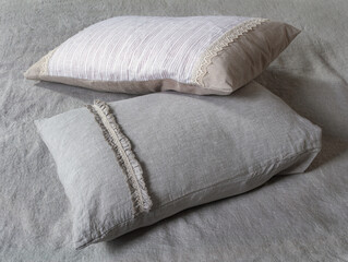 Fototapeta premium Linen textile pillowcases for a bed in a room