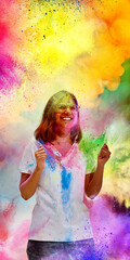 Happy woman celebrating Holi with colorful powder explosion. Concept of vibrant spring festival...